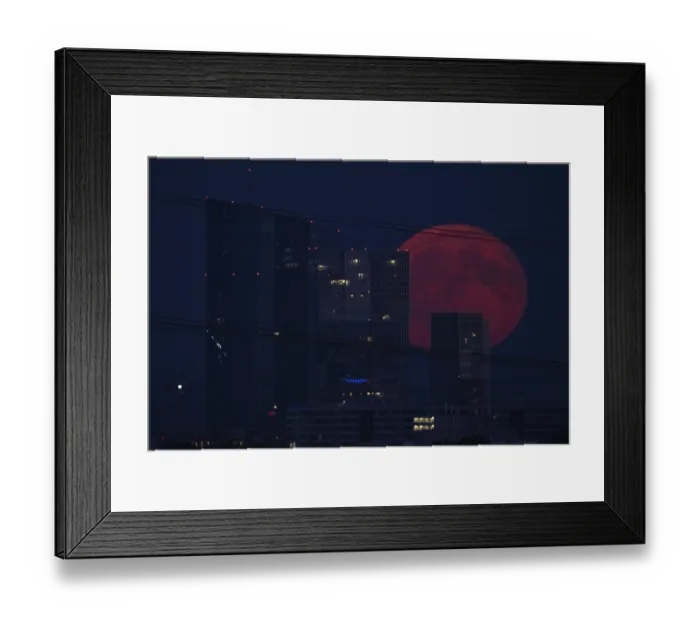 Framed Print : The full moon passes over the Frankfurt banking skyline Framed Print : The full moon passes over the Frankfurt banking skyline