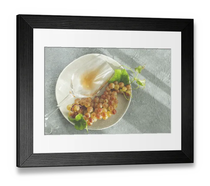 Framed Print : A branch of white grapes, on a gray plate Framed Print : A branch of white grapes, on a gray plate