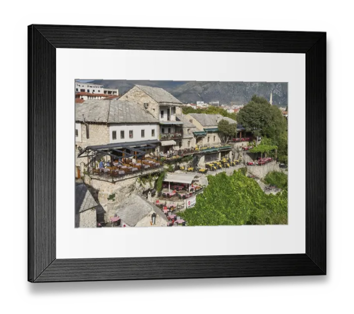 Framed Print : Terraces of restaurants on the banks of the river Neretva