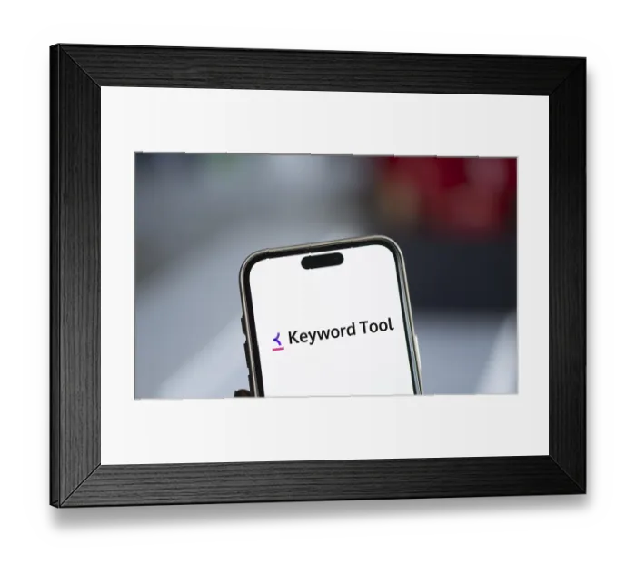 Framed Print : keyword tool logo is displayed on smartphone
