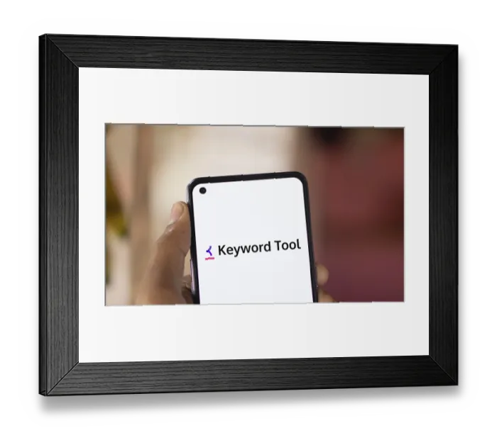 Framed Print : keyword tool logo is displayed on smartphone