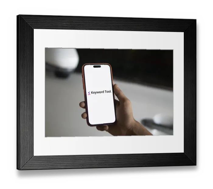 Framed Print : keyword tool logo is displayed on smartphone