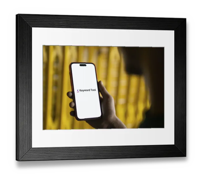 Framed Print : keyword tool logo is displayed on smartphone