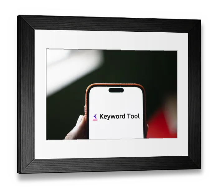 Framed Print : keyword tool logo is displayed on smartphone
