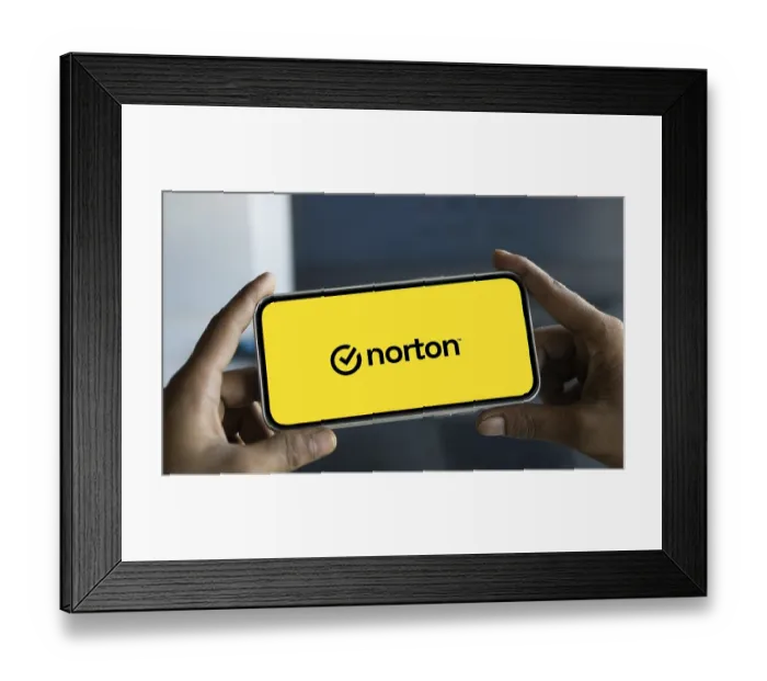 Framed Print : norton logo is displayed on smartphone