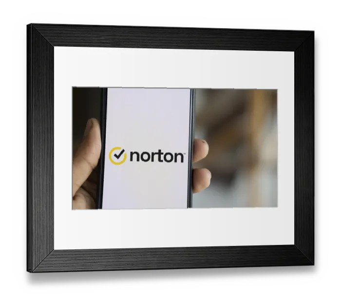 Framed Print : norton logo is displayed on smartphone