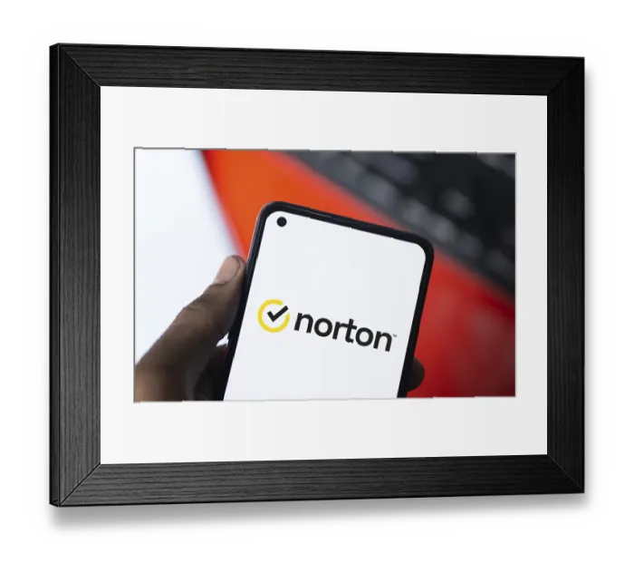 Framed Print : norton logo is displayed on smartphone