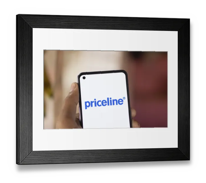 Framed Print : priceline logo is displayed on smartphone