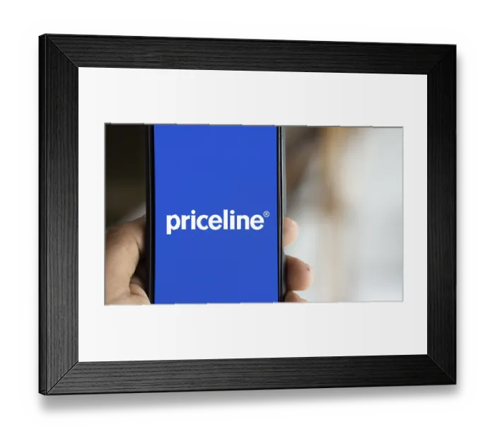 Framed Print : priceline logo is displayed on smartphone