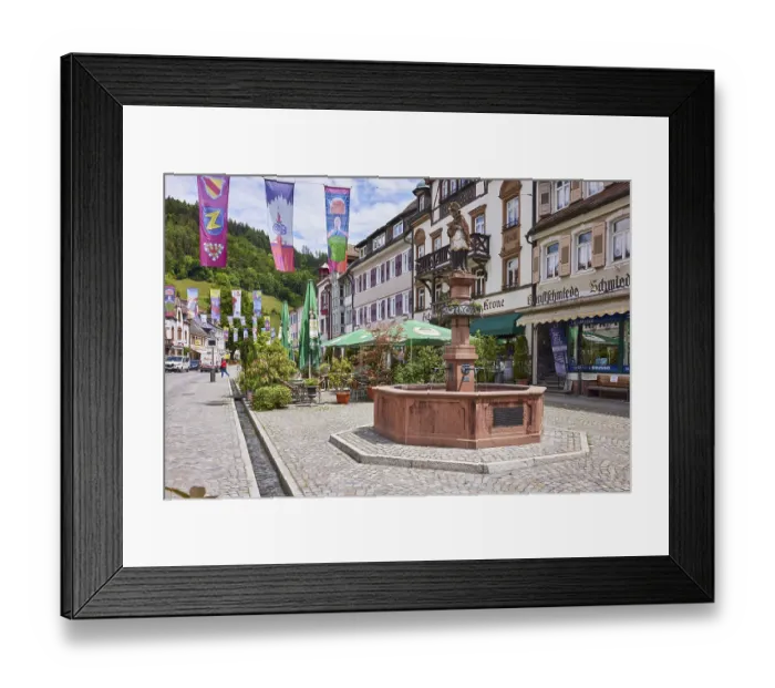 Framed Print : Town fountain, historic buildings