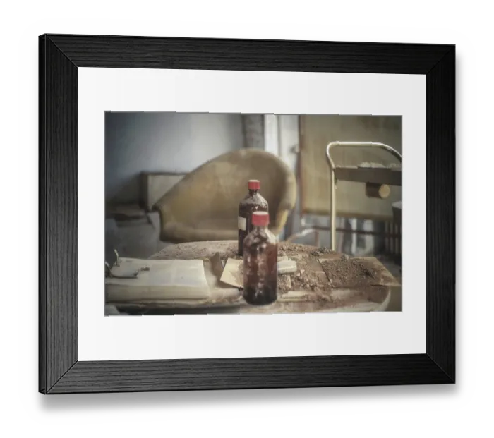 Framed Print : Dusty table with brown bottles and old documents in an abandoned room Framed Print : Dusty table with brown bottles and old documents in an abandoned room