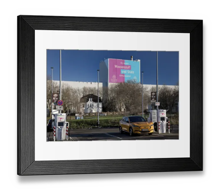 Framed Print : E-charging station and large poster for climate steel at the ThyssenKrupp Steel Europe plant