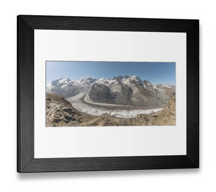 Framed Print : At dawn, the sun bathes the peaks of the Alps in a golden light and reveals stunning glaciers and rocky slopes