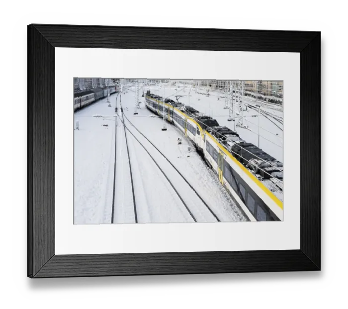Framed Print : Tracks and train covered with snow and ice
