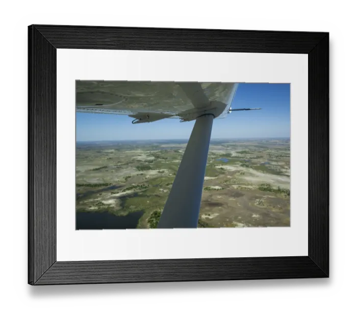 Framed Print : Okavango Delta aerial view with aeroplane wing