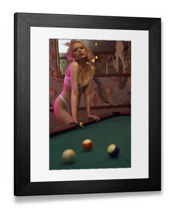 Framed Print : Side view of sensual young female in pink swimsuit leaning on table and looking at camera Framed Print : Side view of sensual young female in pink swimsuit leaning on table and looking at camera