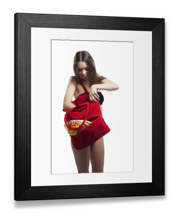 Framed Print : Woman search in red beach bag with towel isolated Framed Print : Woman search in red beach bag with towel isolated