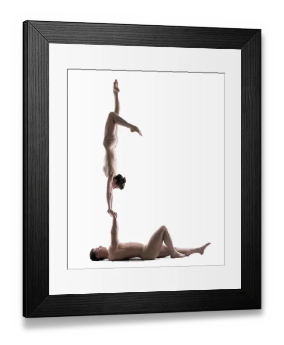 Framed Print : Pair of young acrobats training in studio