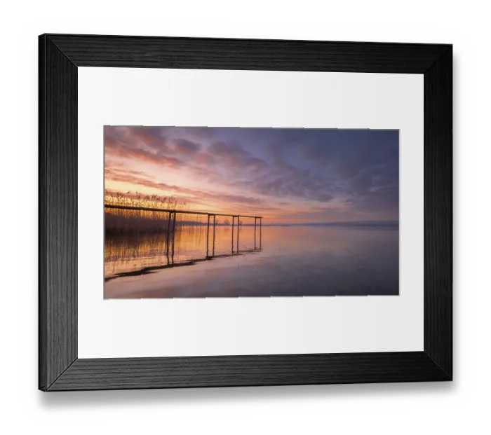 Framed Print : A footbridge leads into the calm Lake Constance at sunrise Framed Print : A footbridge leads into the calm Lake Constance at sunrise