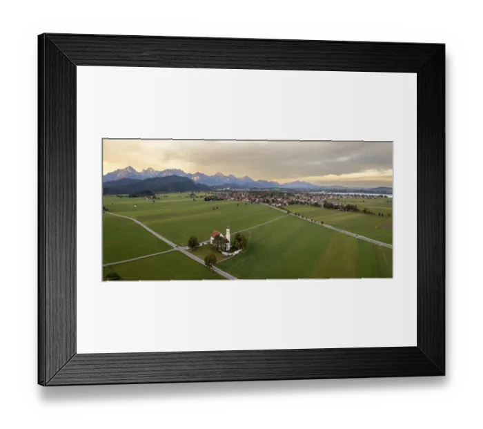 Framed Print : Wide landscape with mountains on the horizon in the evening light