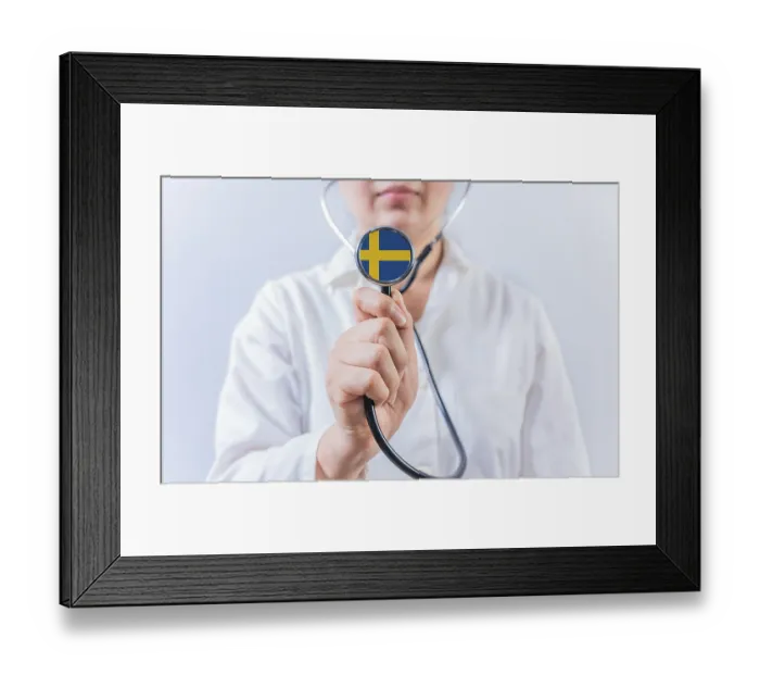 Framed Print : Female doctor holding stethoscope with Swedish flag
