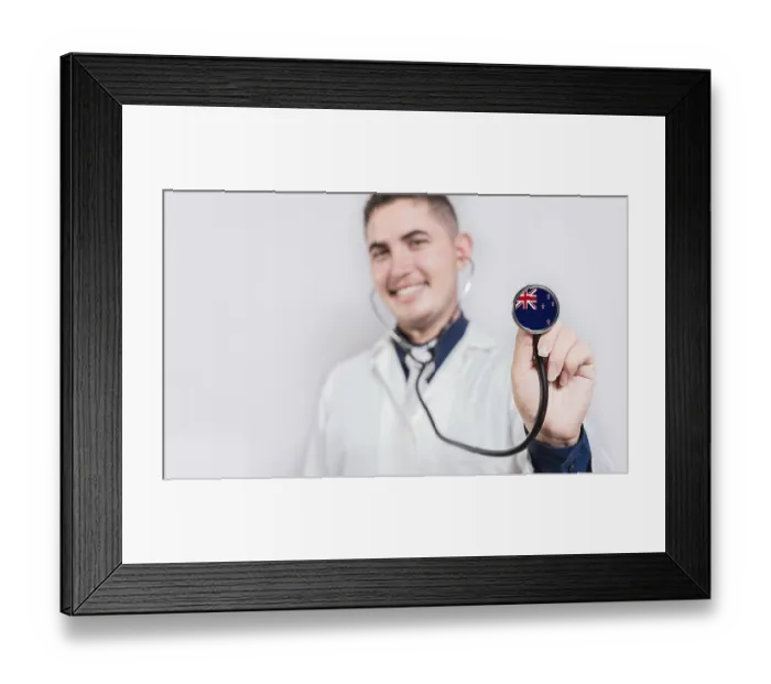 Framed Print : Doctor showing stethoscope with New Zealand flag