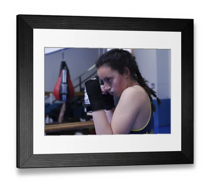 Framed Print : Young female boxer training boxing in the gym in guard position