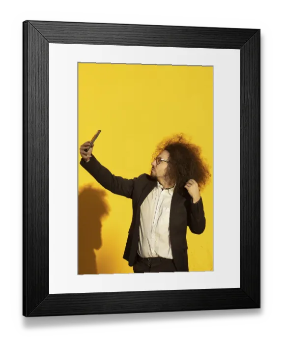 Framed Print : Businessman using a mobile phone taking a selfie
