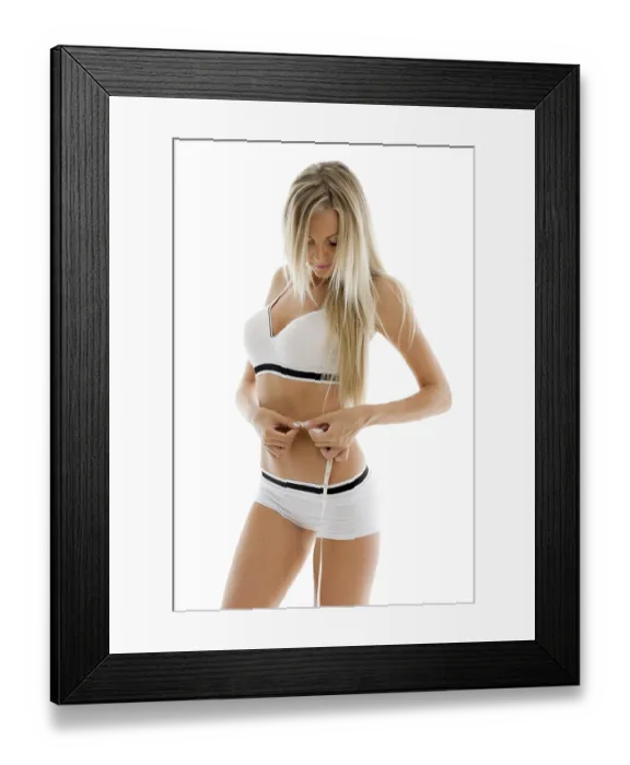 Framed Print : Beautiful blonde measures her waist Framed Print : Beautiful blonde measures her waist