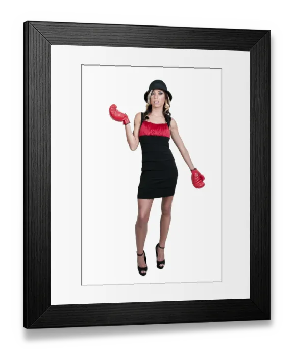 Framed Print : A beautiful young woman wearing a pair of boxing gloves