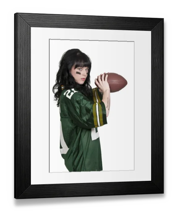 Framed Print : Beautiful young woman playing a game of football