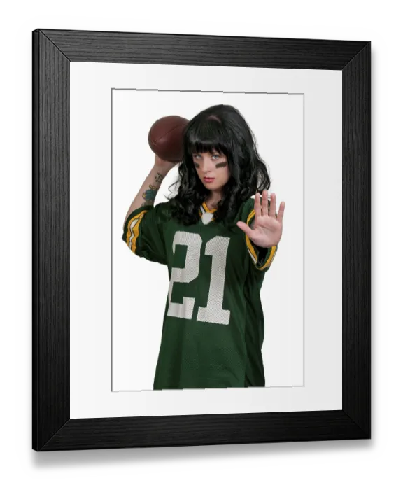 Framed Print : Beautiful young woman playing a game of football