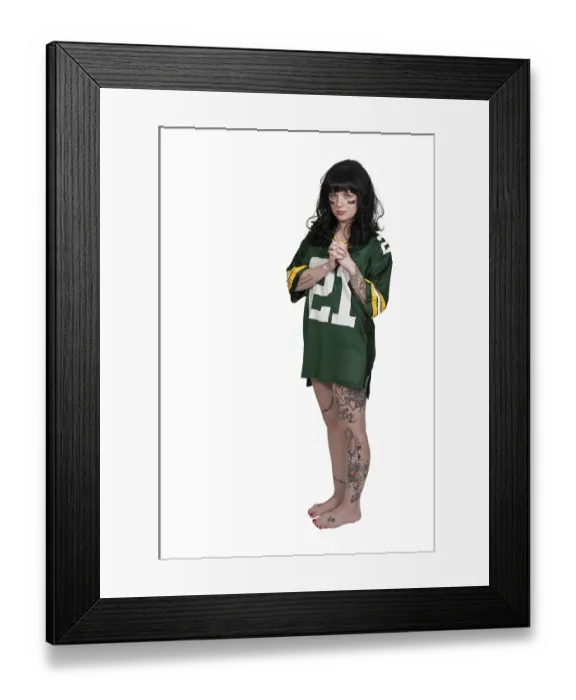 Framed Print : Beautiful young woman playing a game of football