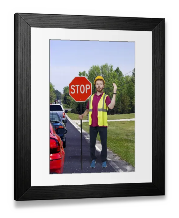 Framed Print : Man flagman holding a stop sign to halt traffic