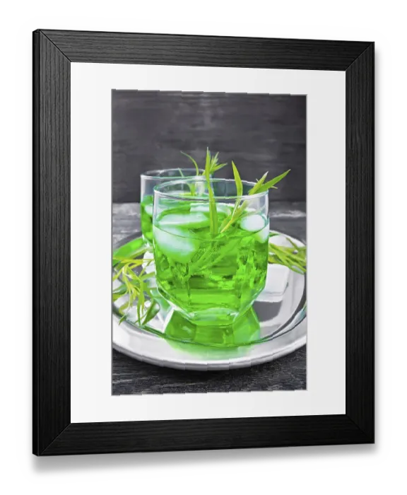 Framed Print : Tarragon lemonade in two glasses with ice on a silver tray on black wooden board background