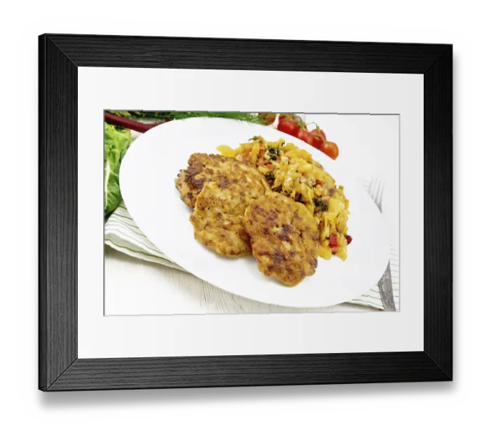 Framed Print : Fritters of minced meat with stewed cabbage in a plate