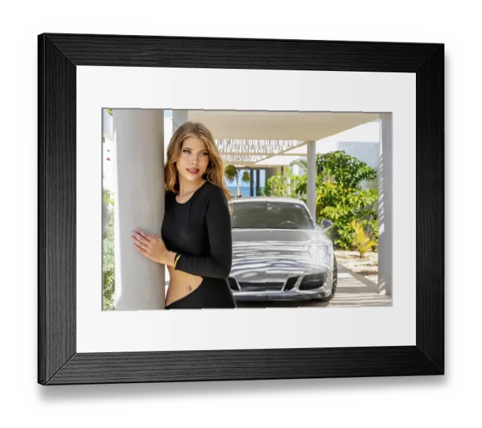Framed Print : Exquisite model strikes a pose by a luxury European sports car