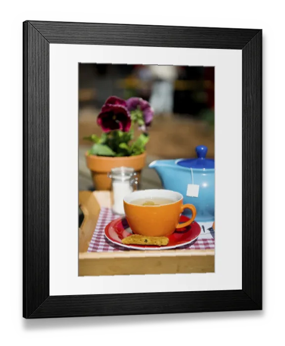 Framed Print : Drinking tea with cookie outdoor on the terrace