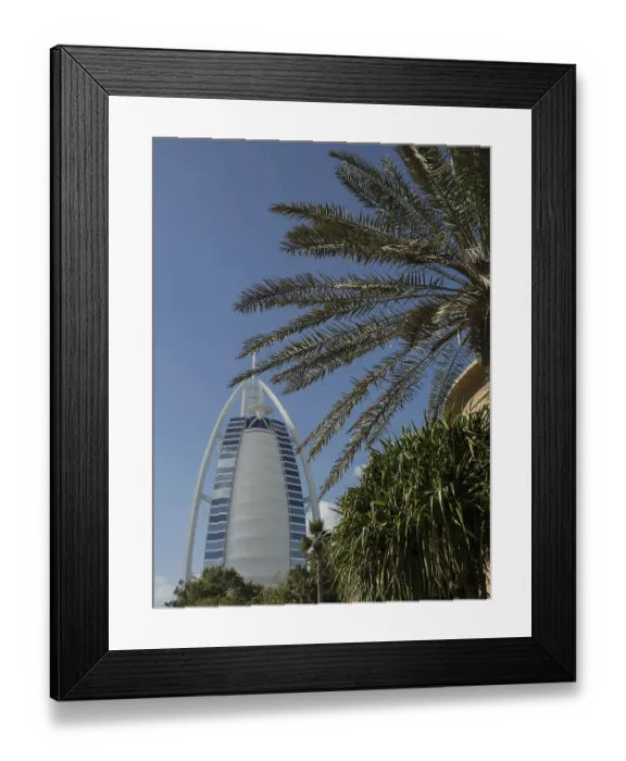 Framed Print : The Burj Al Arab and a palm tree in the foreground on a clear day Framed Print : The Burj Al Arab and a palm tree in the foreground on a clear day