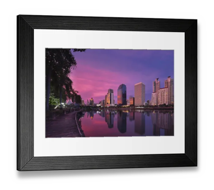 Framed Print : Beautiful landscape with modern high-rise buildings reflecting in calm lake waters by park