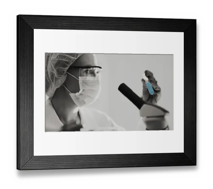 Framed Print : Female scientist working with test tubes in lab