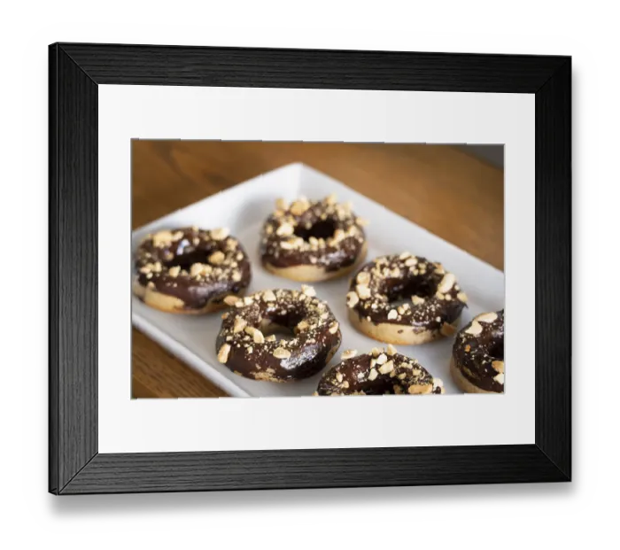 Framed Print : Healthy gluten-free donuts covered in chocolate and almonds Framed Print : Healthy gluten-free donuts covered in chocolate and almonds