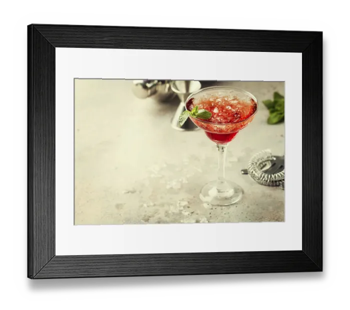 Framed Print : Fresh red margarita cocktail with ice and mint over gray background
