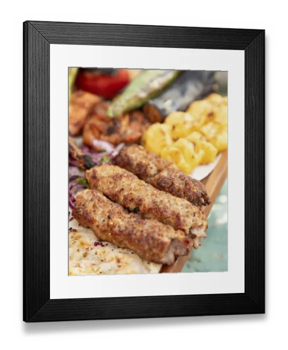 Framed Print : Turkish cuisine - adana kebab with grilled vegetables served on a wooden plate