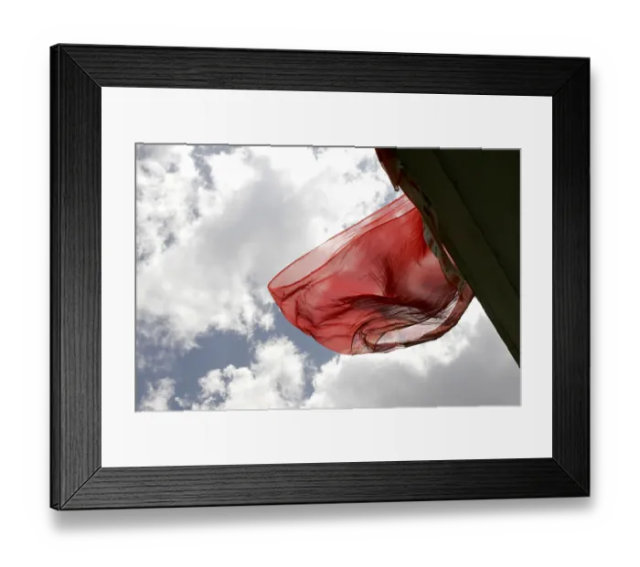 Framed Print : Indian traditional ladies wear saris flying in air against white clouds and blue skies