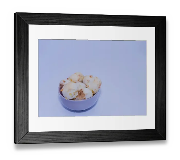 Framed Print : A bowl of bread rolls set against a simple white background with a blue tint Framed Print : A bowl of bread rolls set against a simple white background with a blue tint