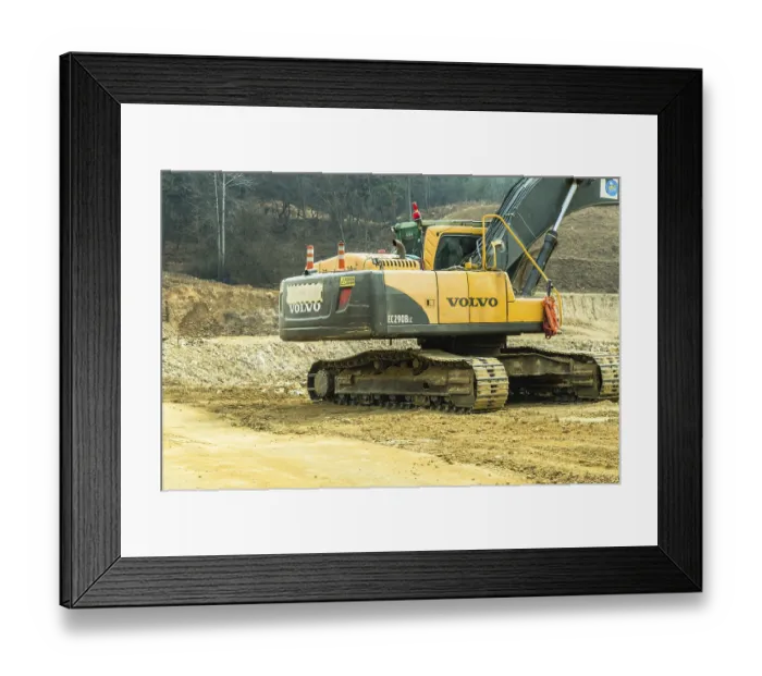 Framed Print : Daejeon, South Korea. March 3, 2019: Backhoe sitting idle at construction site in mountainous area