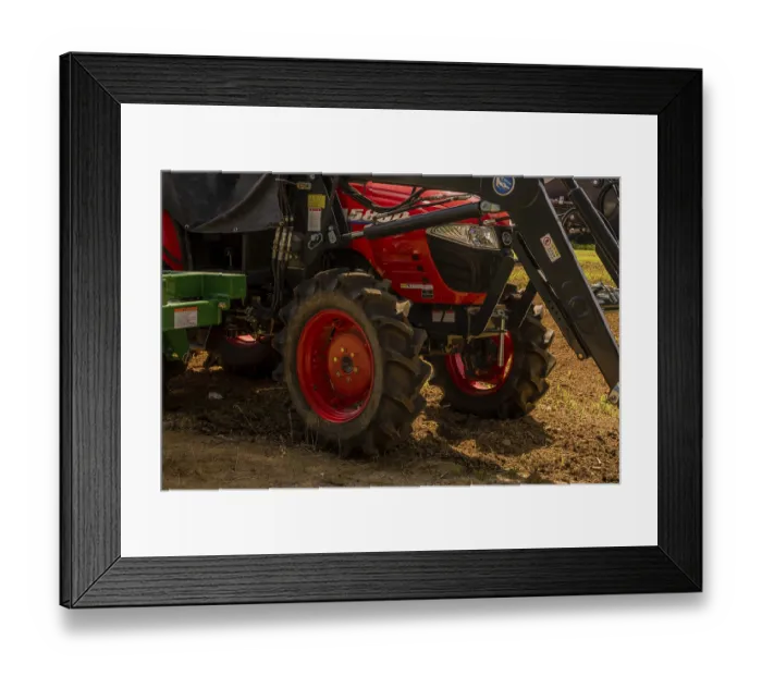 Framed Print : Daejeon, South Korea. May 26, 2019: Closeup of red tractor parked at edge of freshly planted field