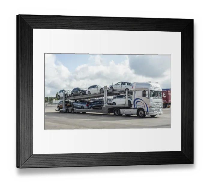 Framed Print : A lorry transports several new cars
