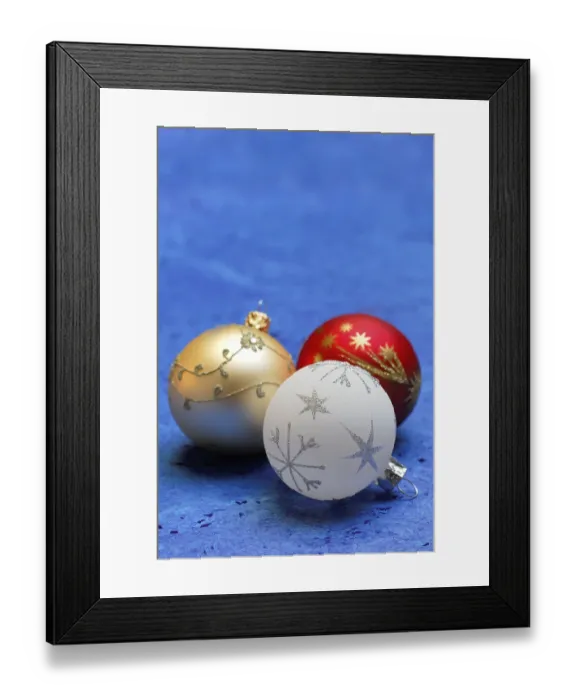Framed Print : Christmas tree baubles on a blue background
